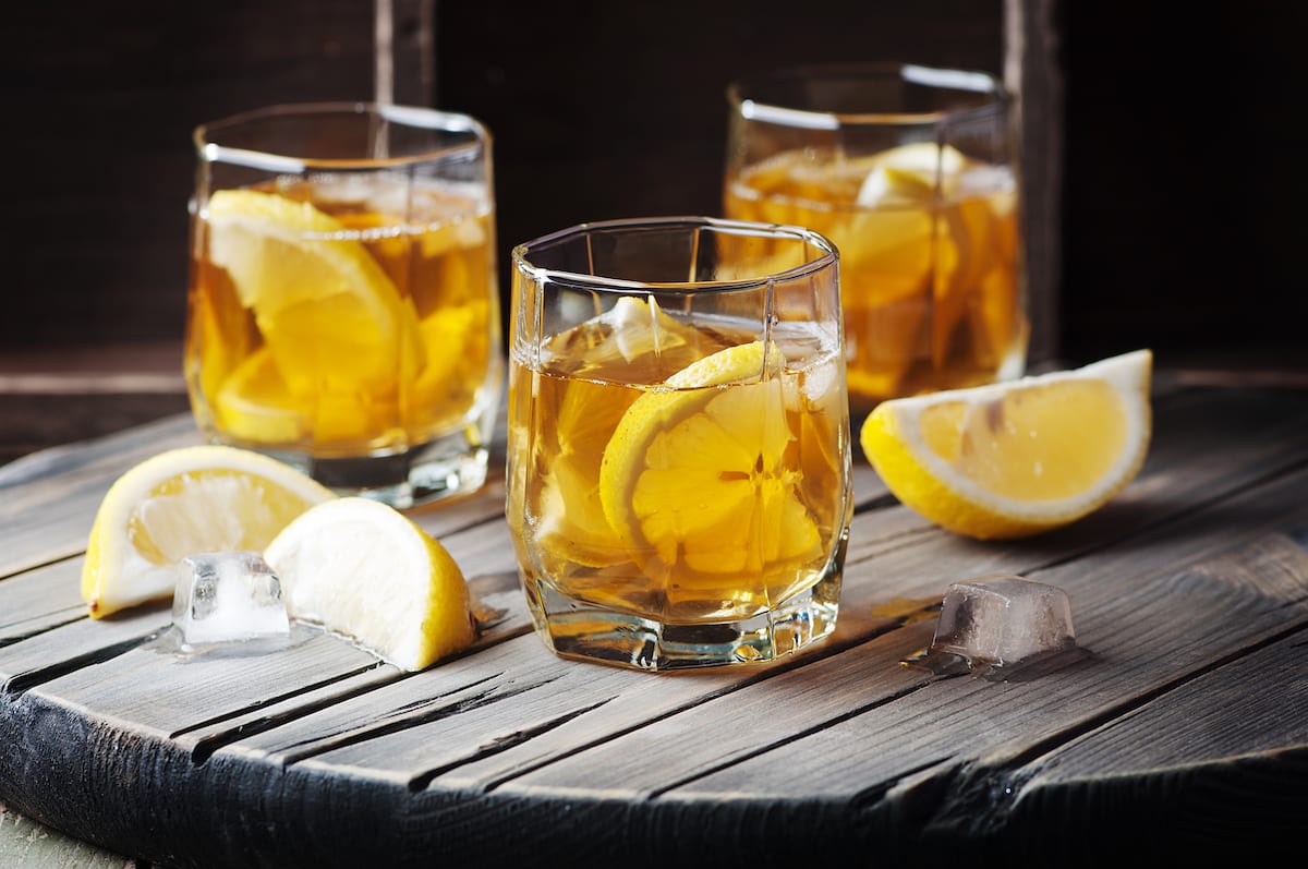 Cold whiskey with ice and lemons