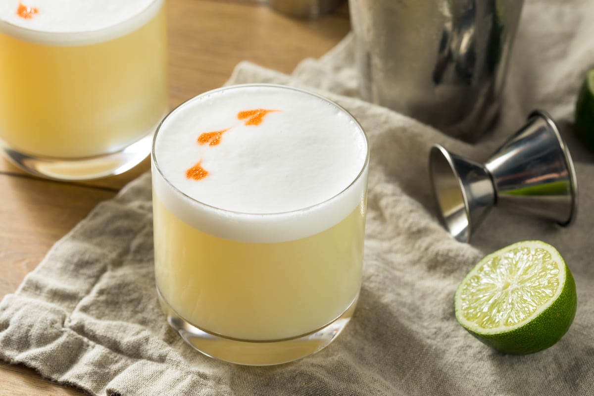 Pisco sour cocktail with lime